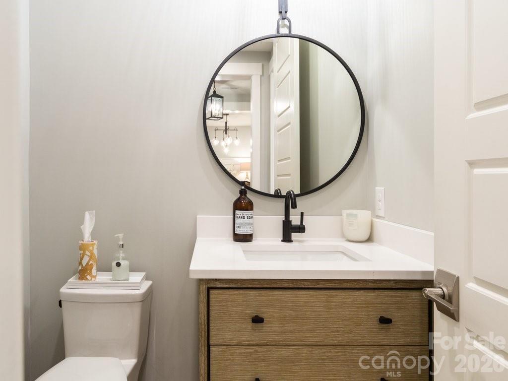 110 Willow Vw Loop Davidson, NC 28036 - Photo 40 of 42 a bathroom with a sink and a mirror
