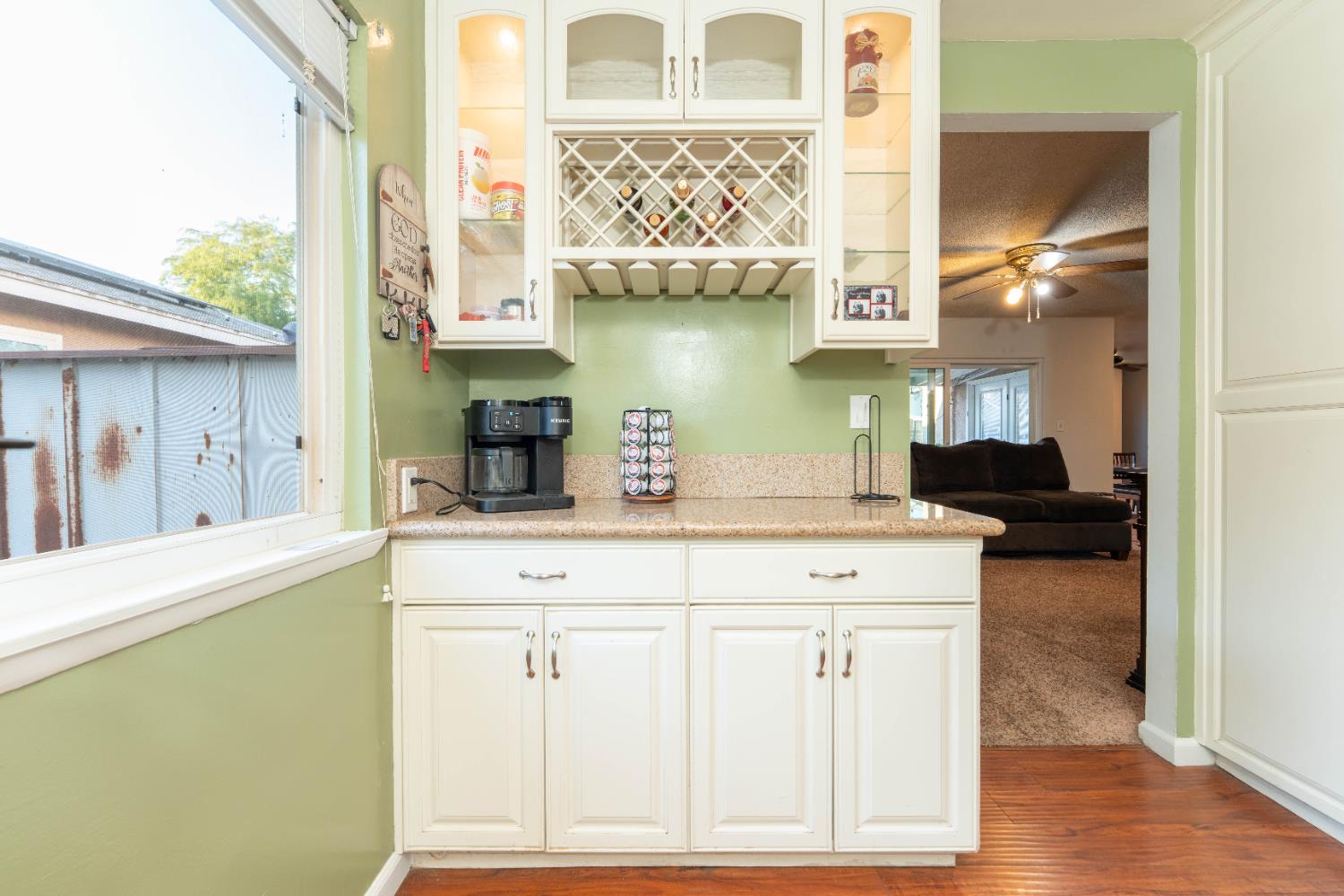 1574 Bluejay Circle Hanford, CA 93230 - Photo 12 of 23 a kitchen with stainless steel appliances granite countertop a sink and cabinets with wooden floor