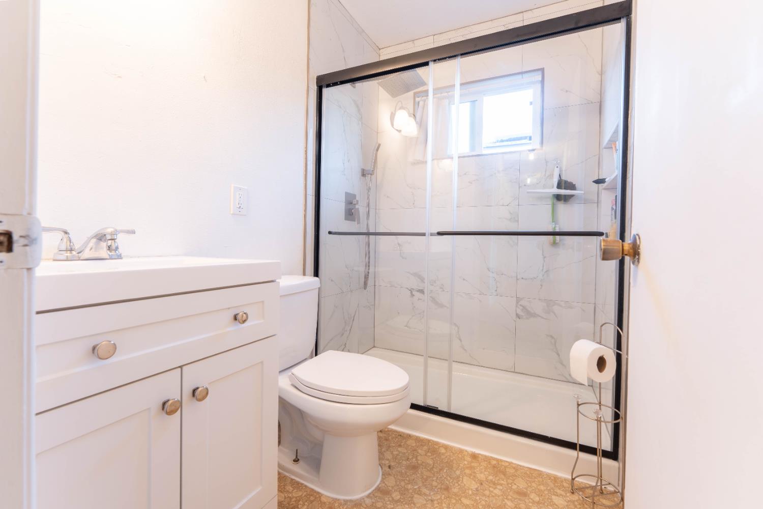 1574 Bluejay Circle Hanford, CA 93230 - Photo 19 of 23 a bathroom with a sink toilet and shower