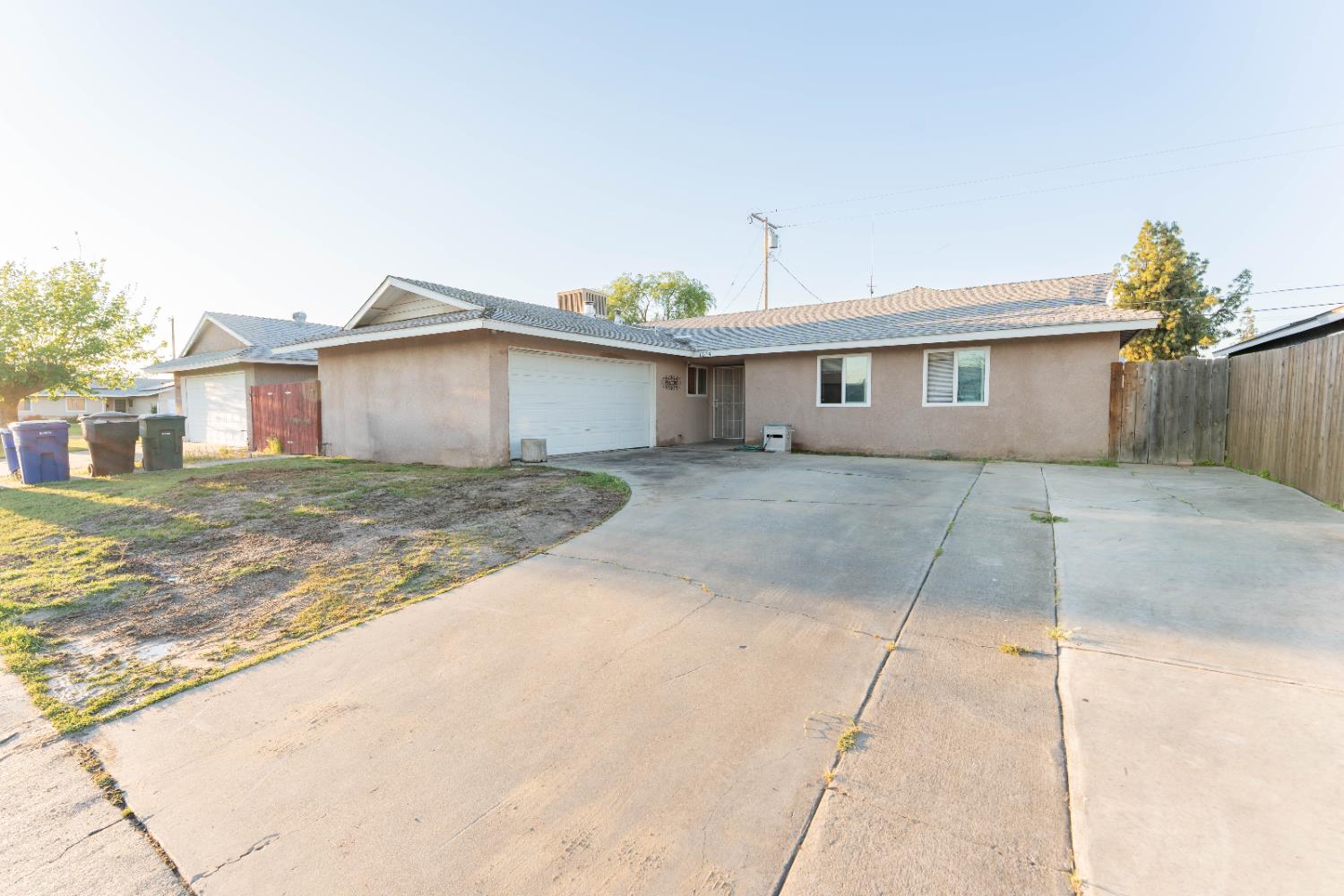 1574 Bluejay Circle Hanford, CA 93230 - Photo 2 of 23 a view of a house with a yard