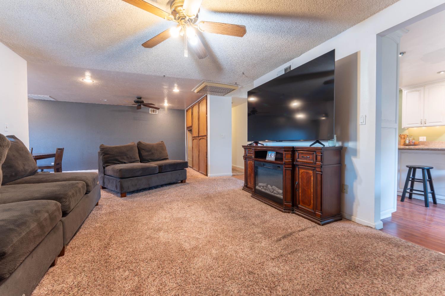 1574 Bluejay Circle Hanford, CA 93230 - Photo 6 of 23 a living room with furniture and a flat screen tv