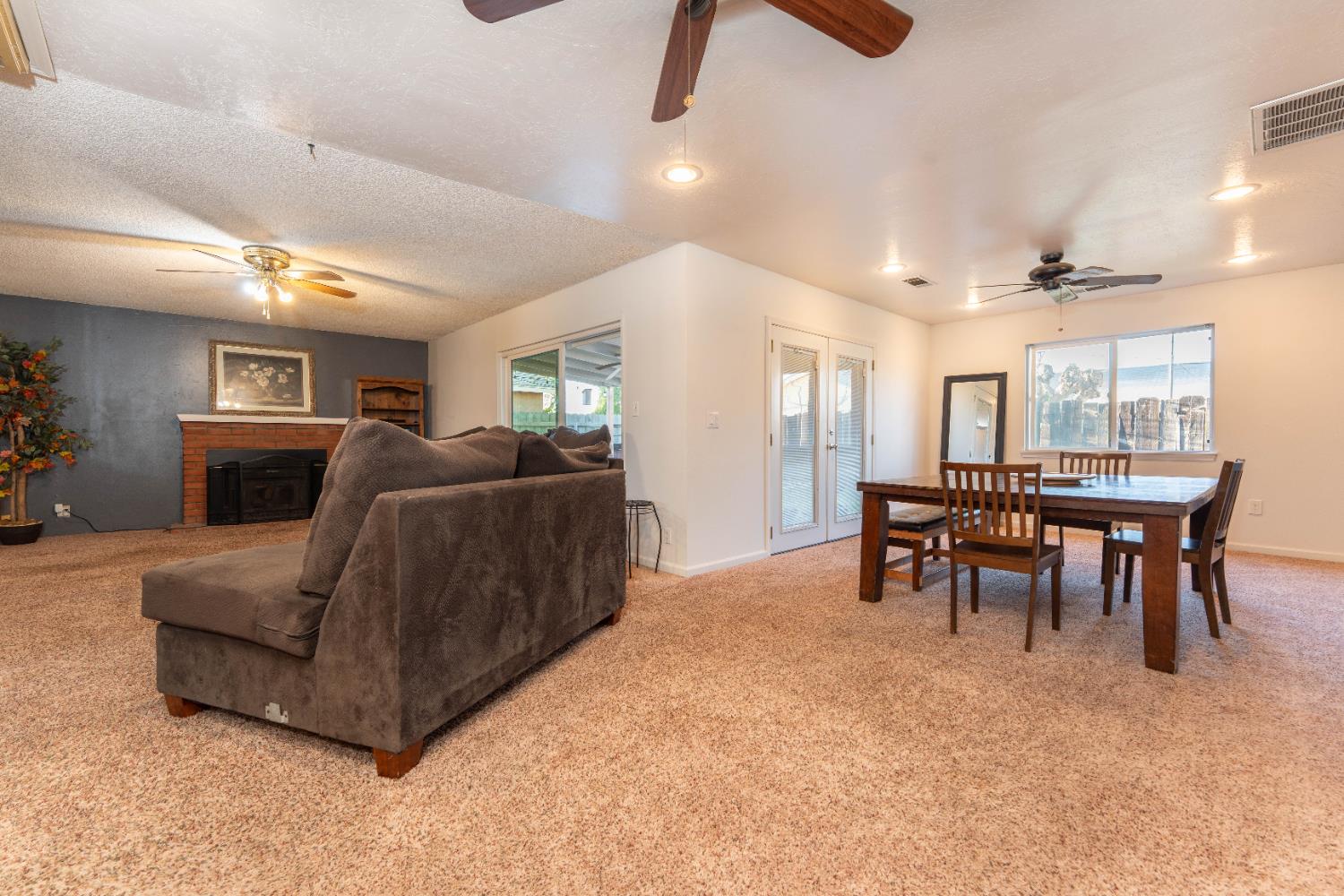1574 Bluejay Circle Hanford, CA 93230 - Photo 7 of 23 a living room with furniture and a dining room