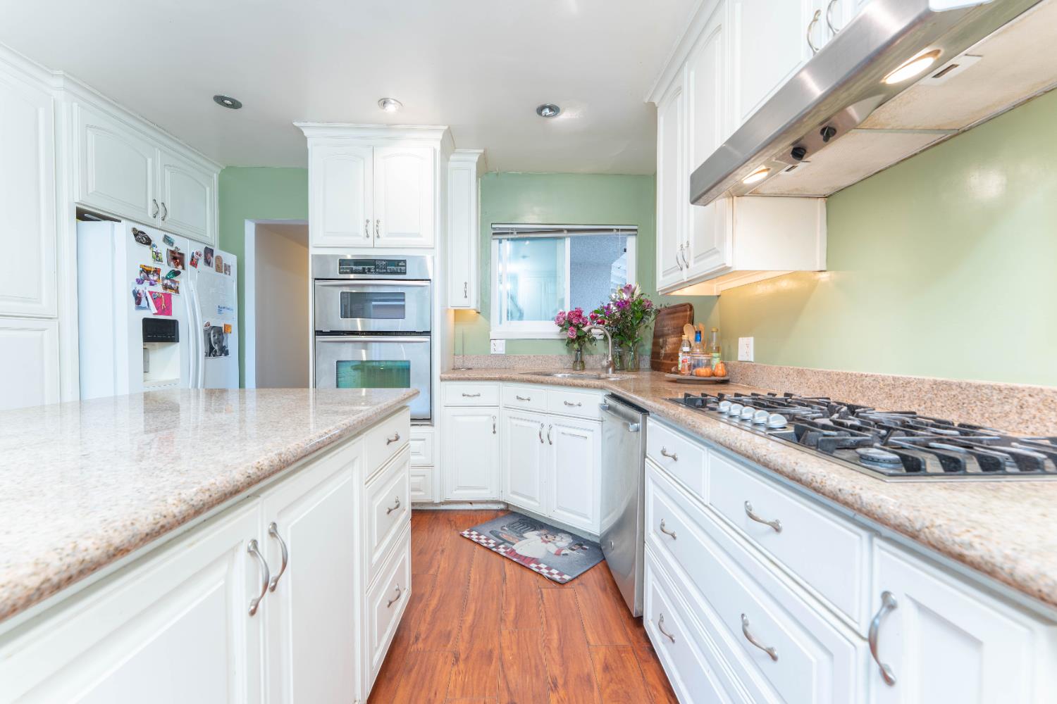 1574 Bluejay Circle Hanford, CA 93230 - Photo 9 of 23 a kitchen with stainless steel appliances granite countertop a sink and cabinets