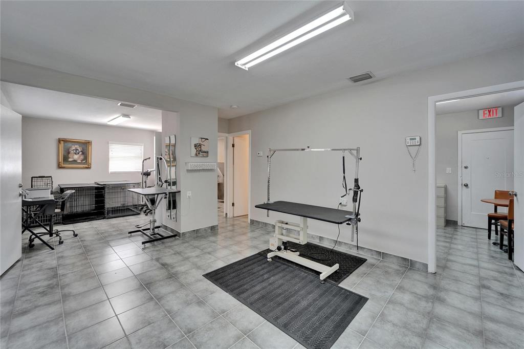 126 Ridgewood Avenue Brandon, FL 33510 - Photo 14 of 85 a room with gym equipment and view of living room