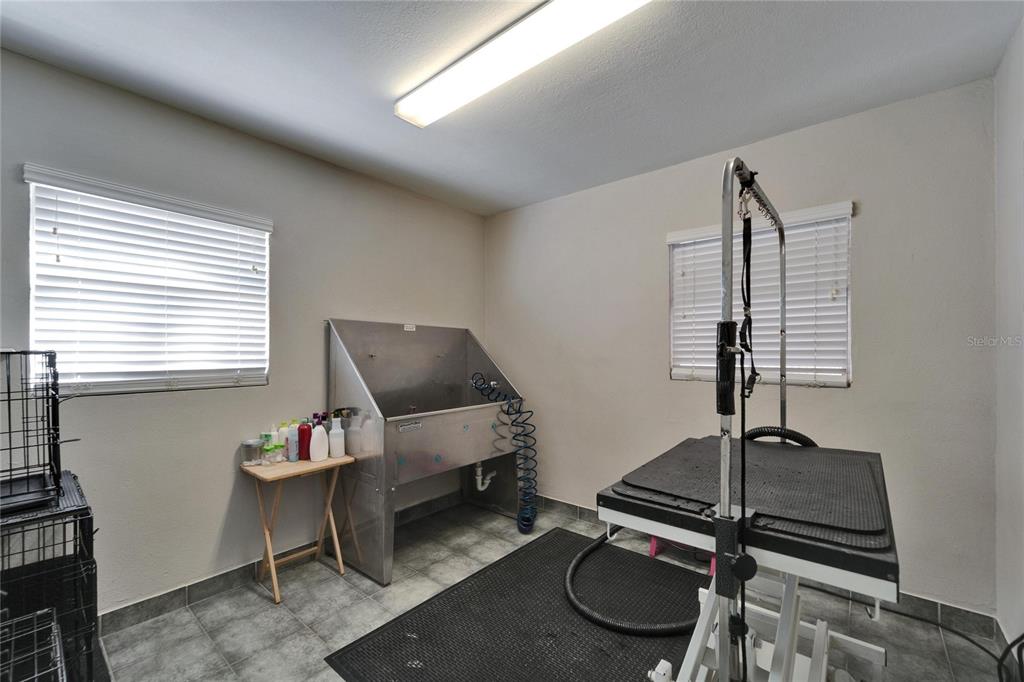 126 Ridgewood Avenue Brandon, FL 33510 - Photo 22 of 85 a room with furniture gym equipment and a window