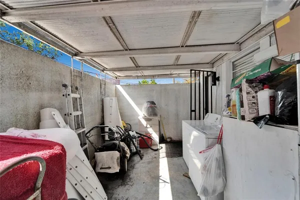 an aerial view of a house with a yard and sitting area