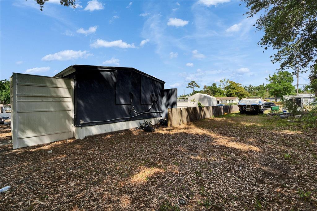 126 Ridgewood Avenue Brandon, FL 33510 - Photo 47 of 85 a view of a barn in the middle of a yard