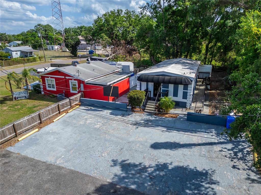 126 Ridgewood Avenue Brandon, FL 33510 - Photo 52 of 85 a view of a patio with table and chairs under an umbrella