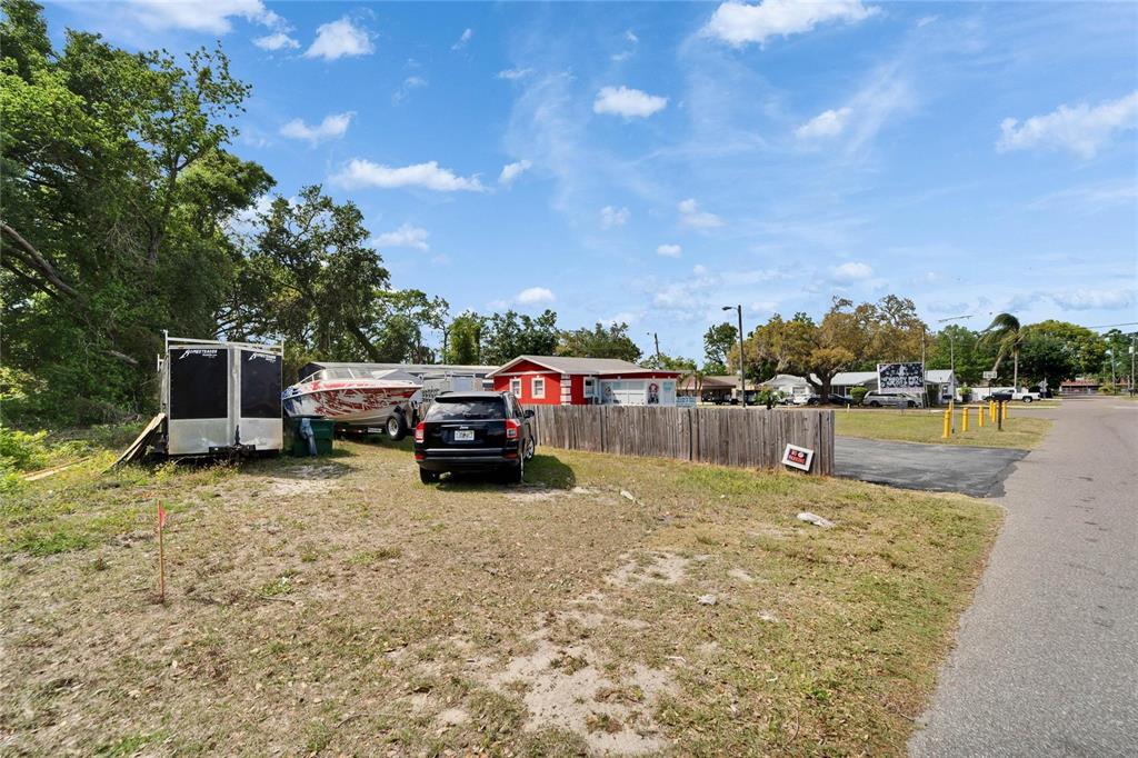 126 Ridgewood Avenue Brandon, FL 33510 - Photo 62 of 85 a view of a lake with a car parked in the background