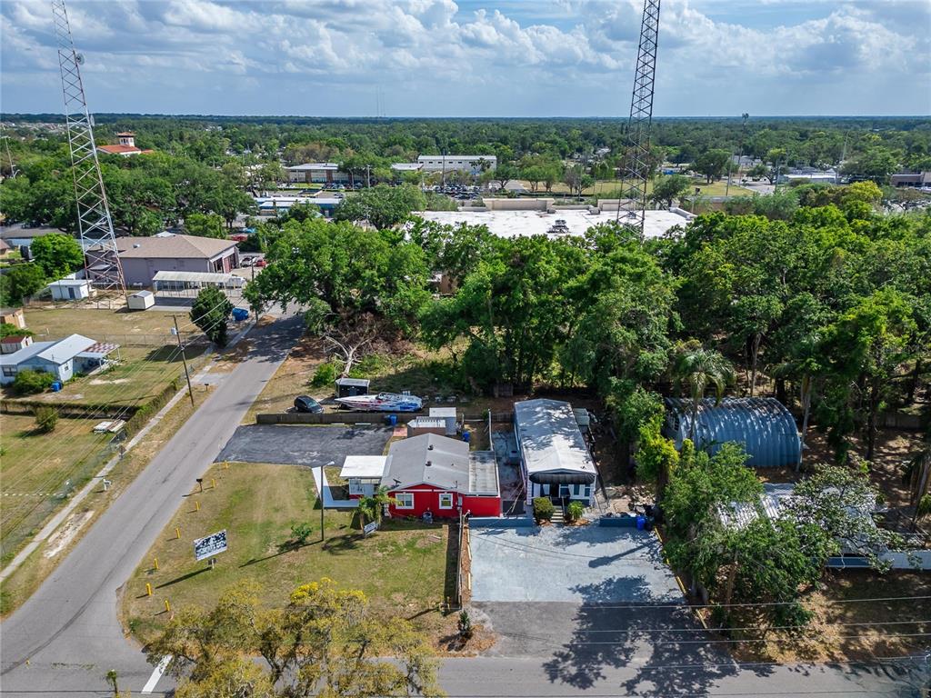 126 Ridgewood Avenue Brandon, FL 33510 - Photo 81 of 85 an aerial view of a house with a garden and lake view