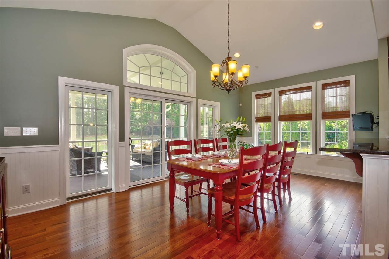 209 Bridle Boast Road Cary, NC 27519 - Photo 13 of 25 a view of a dining room with furniture window and wooden floor