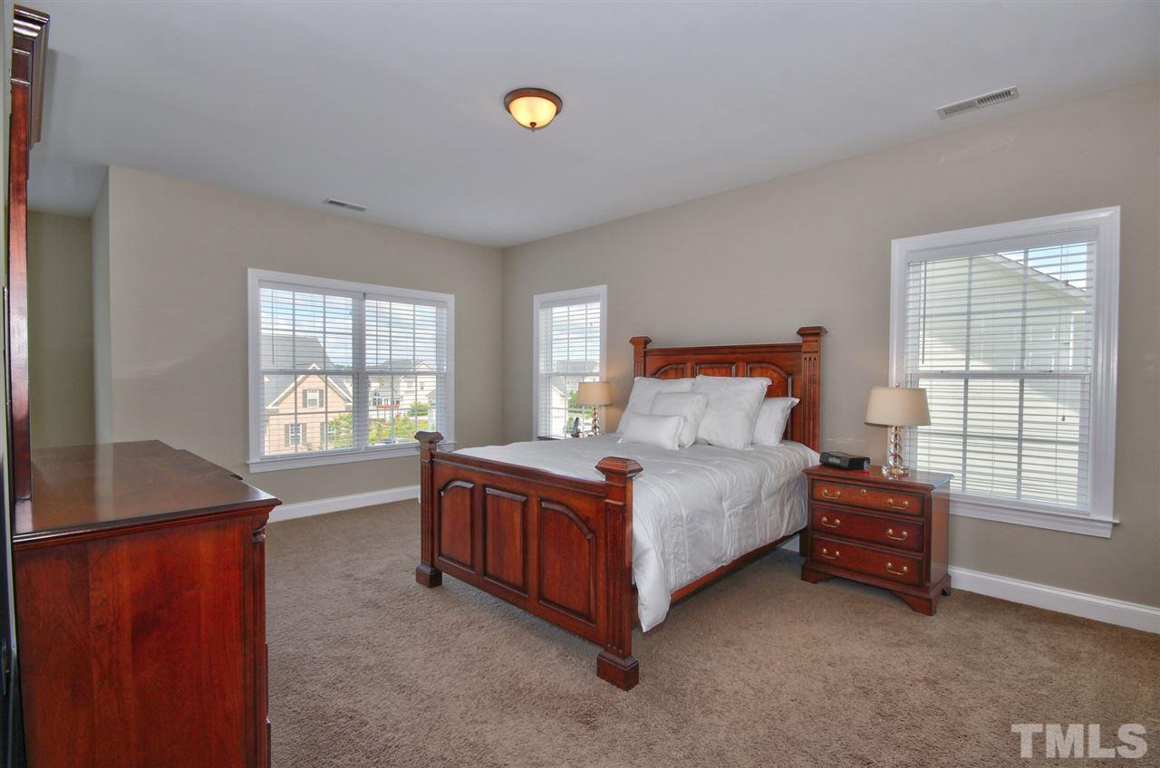 209 Bridle Boast Road Cary, NC 27519 - Photo 16 of 25 a bed room with a bed and a window