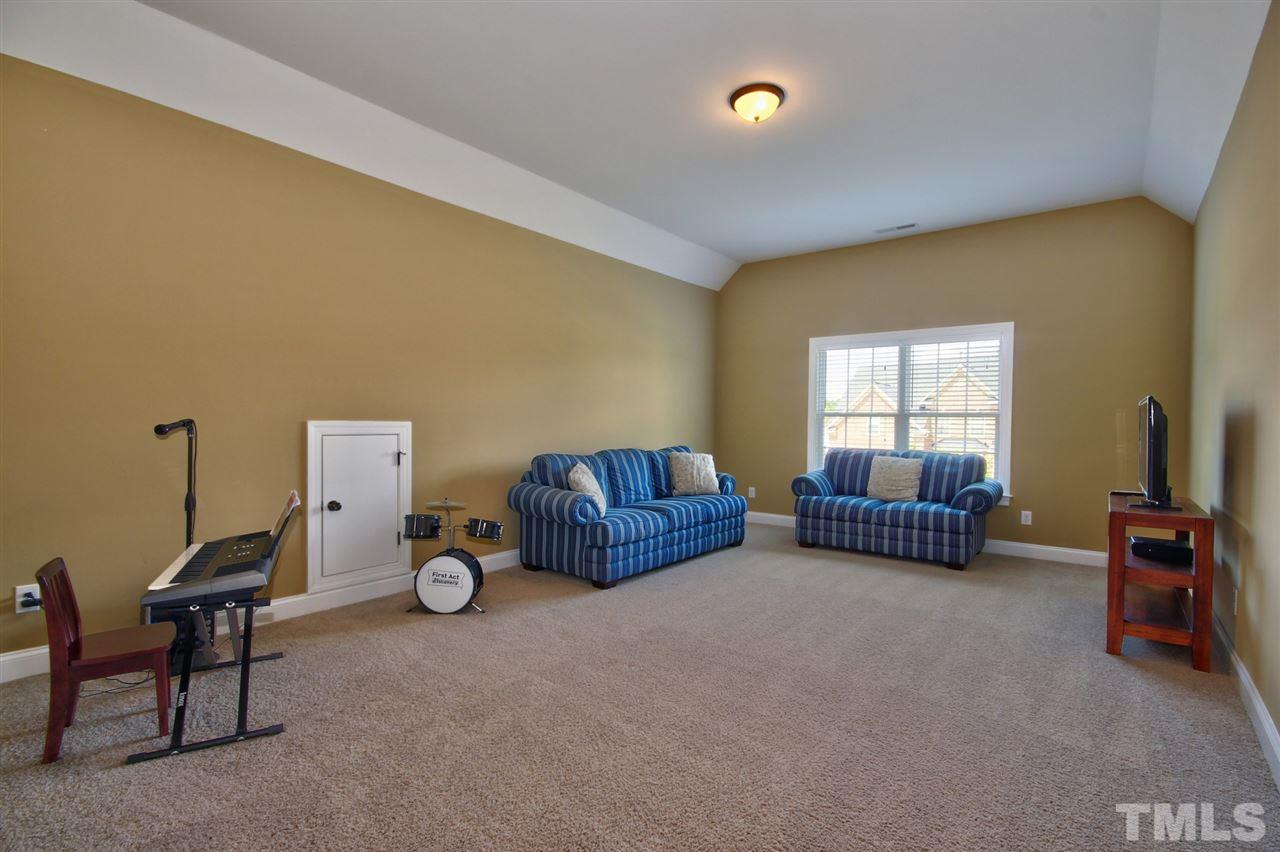 209 Bridle Boast Road Cary, NC 27519 - Photo 22 of 25 a bedroom with furniture and a window
