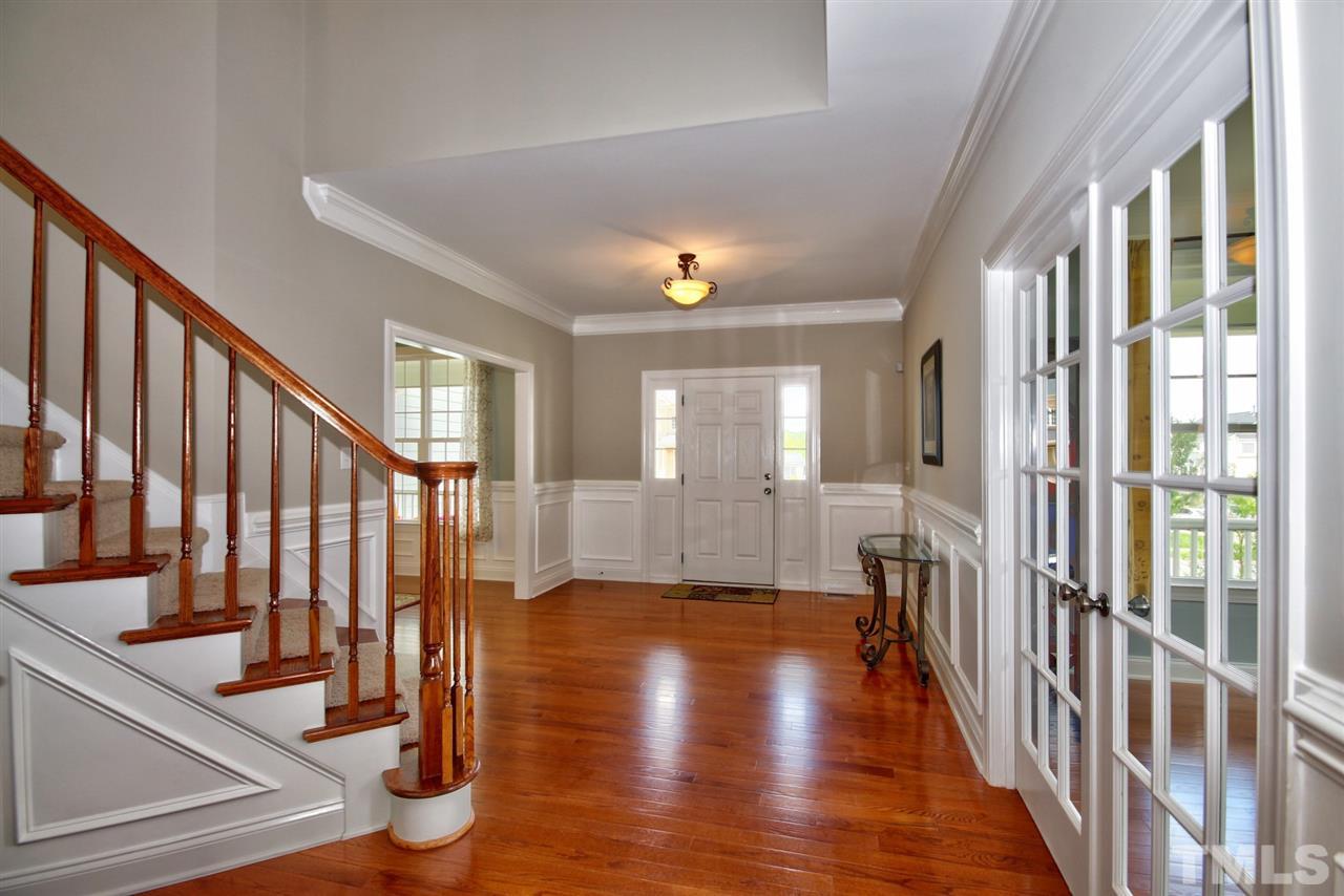 209 Bridle Boast Road Cary, NC 27519 - Photo 4 of 25 a view of an entryway with wooden floor and door