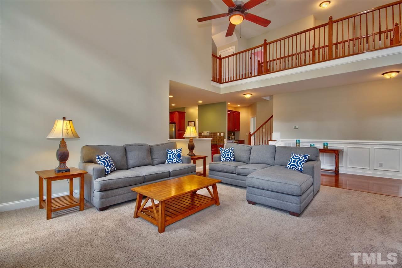 209 Bridle Boast Road Cary, NC 27519 - Photo 10 of 25 a living room with furniture and a ceiling fan