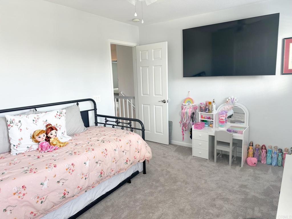29824 Talitha Way Murrieta, CA 92563 - Photo 20 of 27 a bedroom with a bed and a flat screen tv