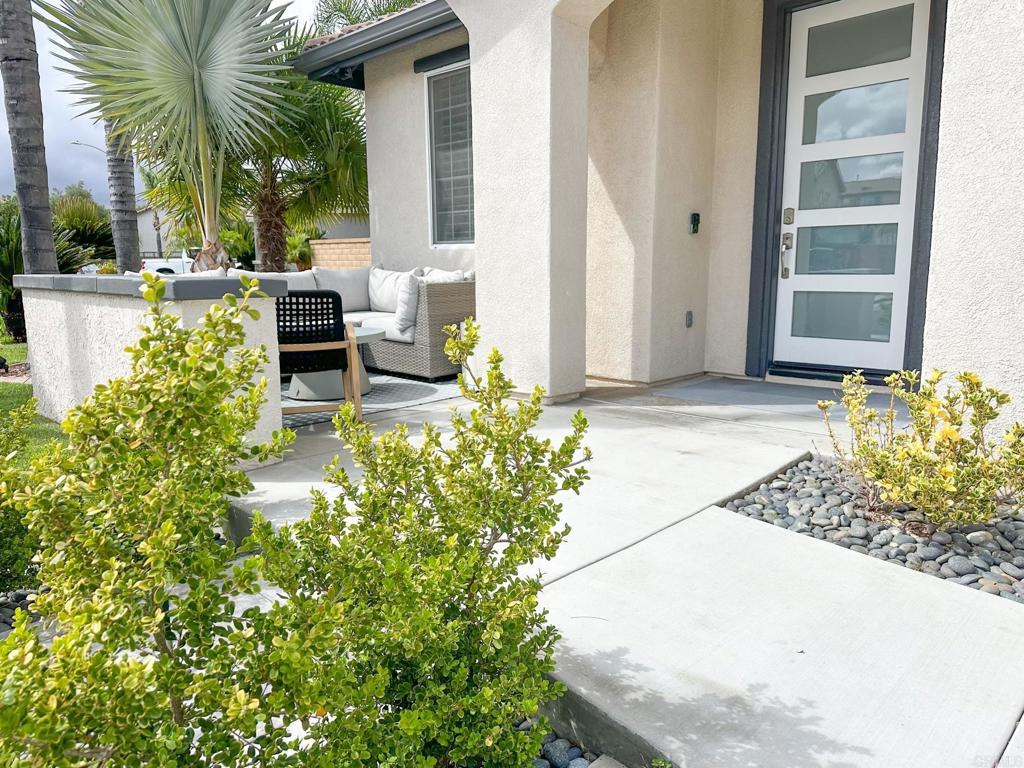 29824 Talitha Way Murrieta, CA 92563 - Photo 4 of 27 a view of backyard of house with outdoor seating and green space