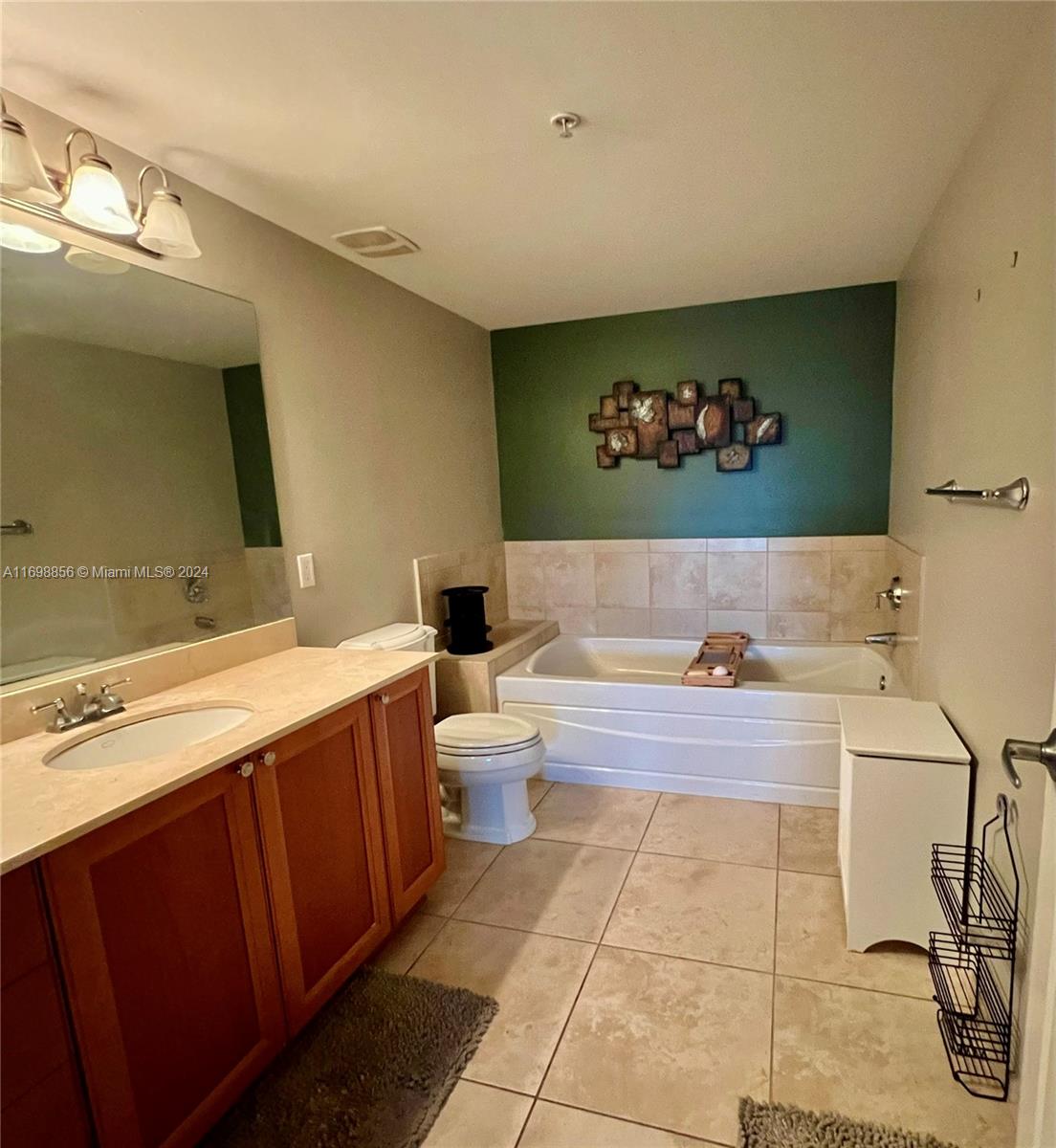 55 Merrick Way, Unit 730 Coral Gables, FL 33134 - Photo 17 of 23 a spacious bathroom with a bathtub and a sink