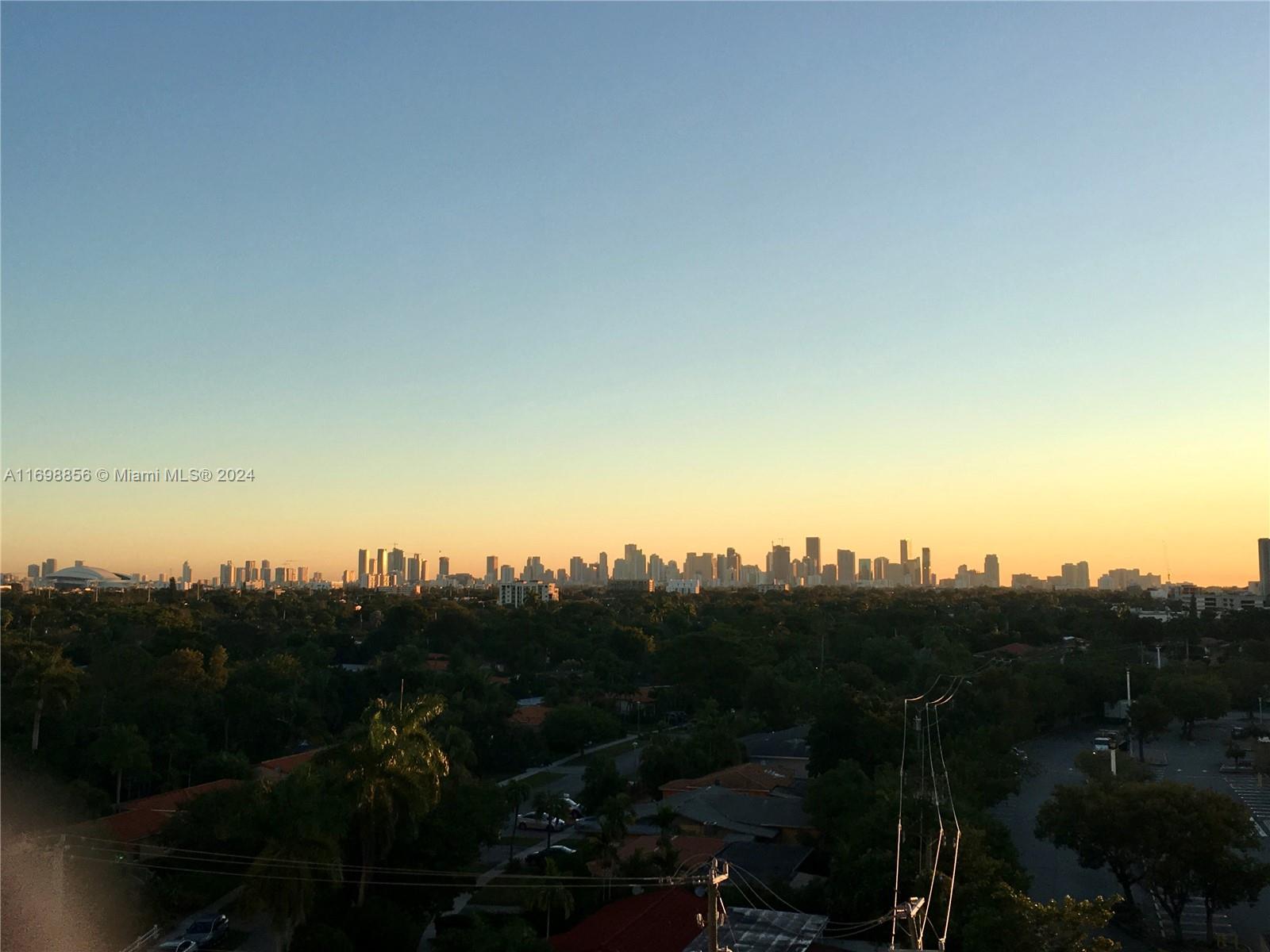 55 Merrick Way, Unit 730 Coral Gables, FL 33134 - Photo 9 of 23 a view of a city with sunset view