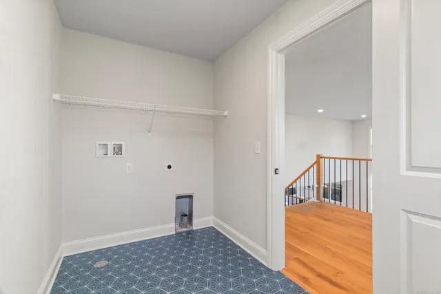 a living room with furniture and windows