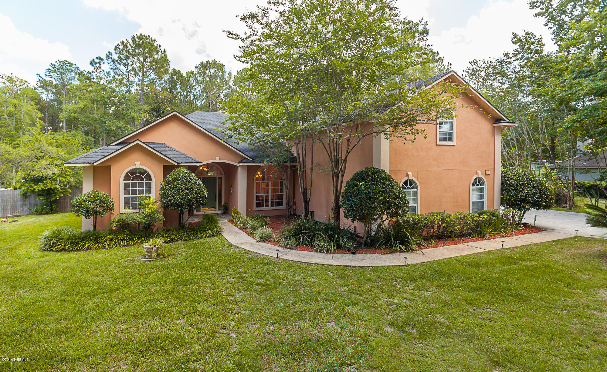 680 Roberts Road St. Johns, FL 32259 - Photo 1 of 45 a front view of house with a yard and green space