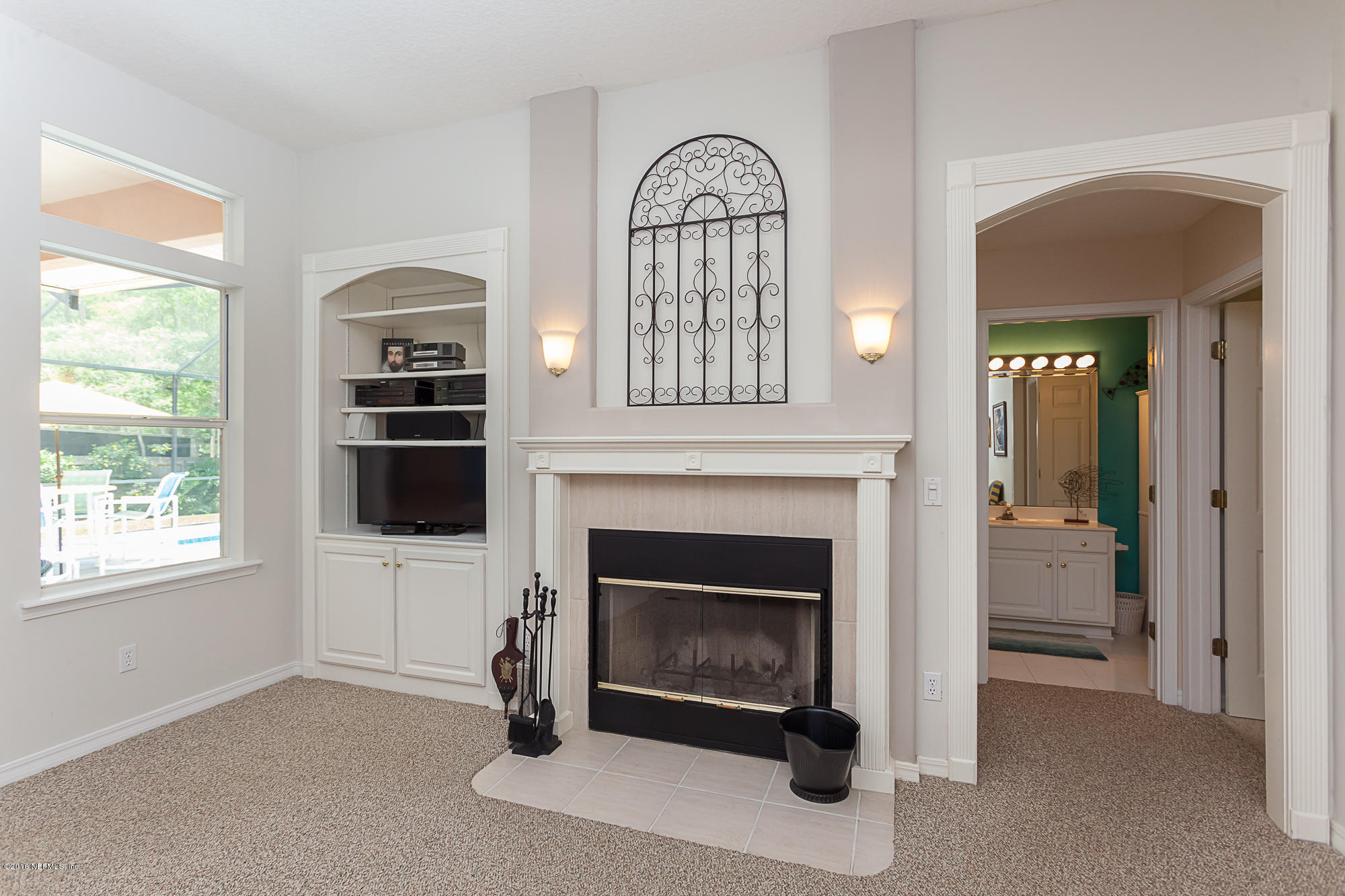 680 Roberts Road St. Johns, FL 32259 - Photo 17 of 45 a living room with furniture and a fireplace