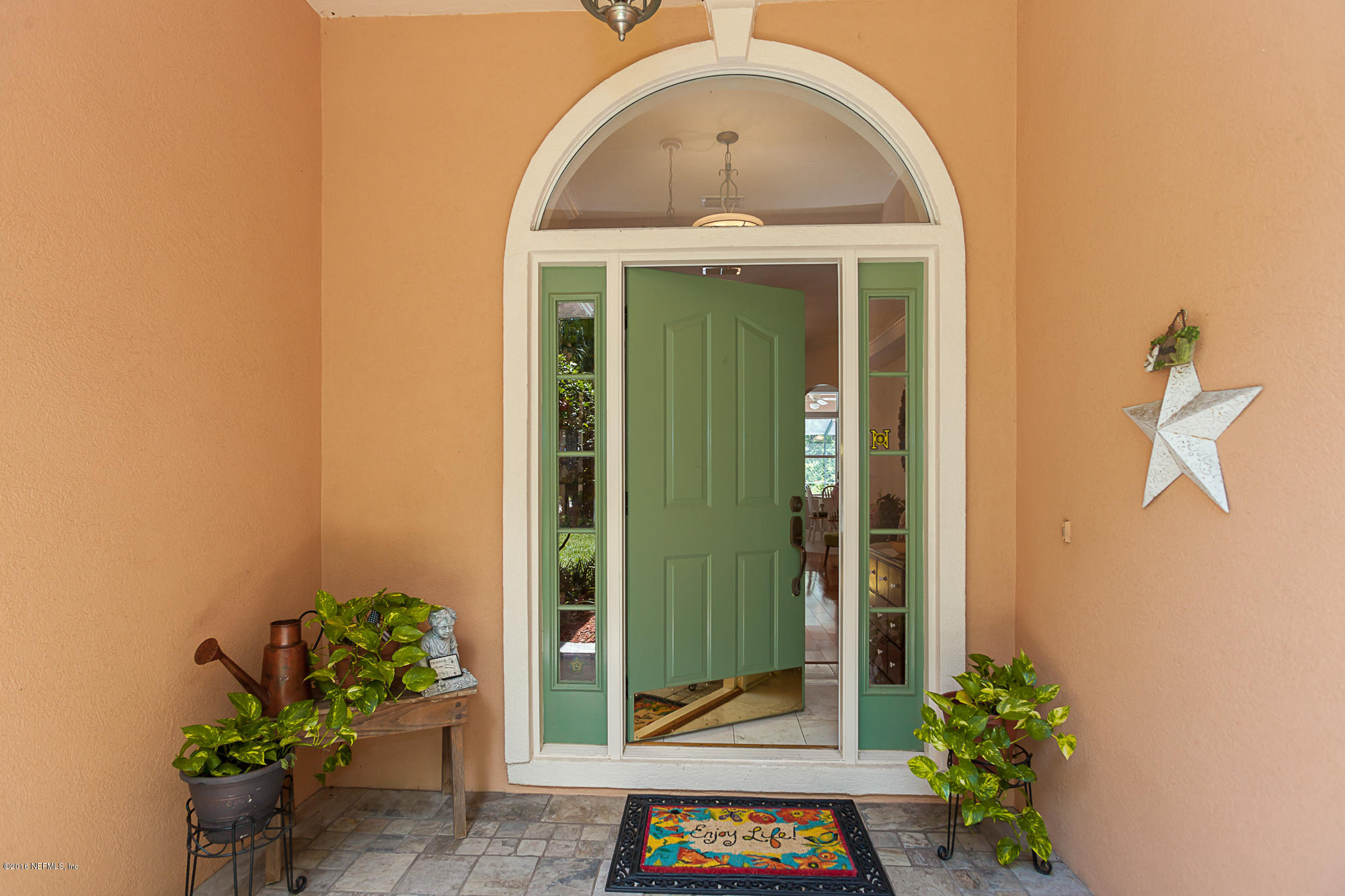 680 Roberts Road St. Johns, FL 32259 - Photo 4 of 45 a front view of a house with a garden