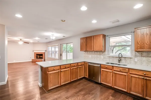 a kitchen with sink stove and microwave