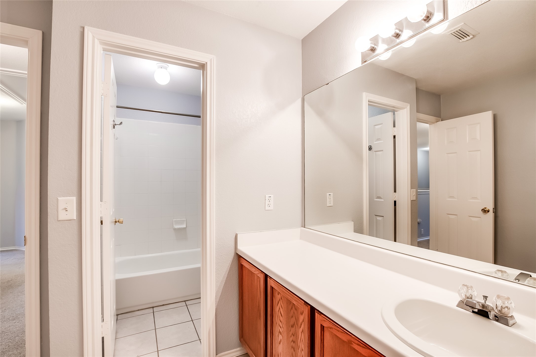 1204 Mathias Street Cedar Park, TX 78613 - Photo 25 of 32 a bathroom with a bathtub and a sink
