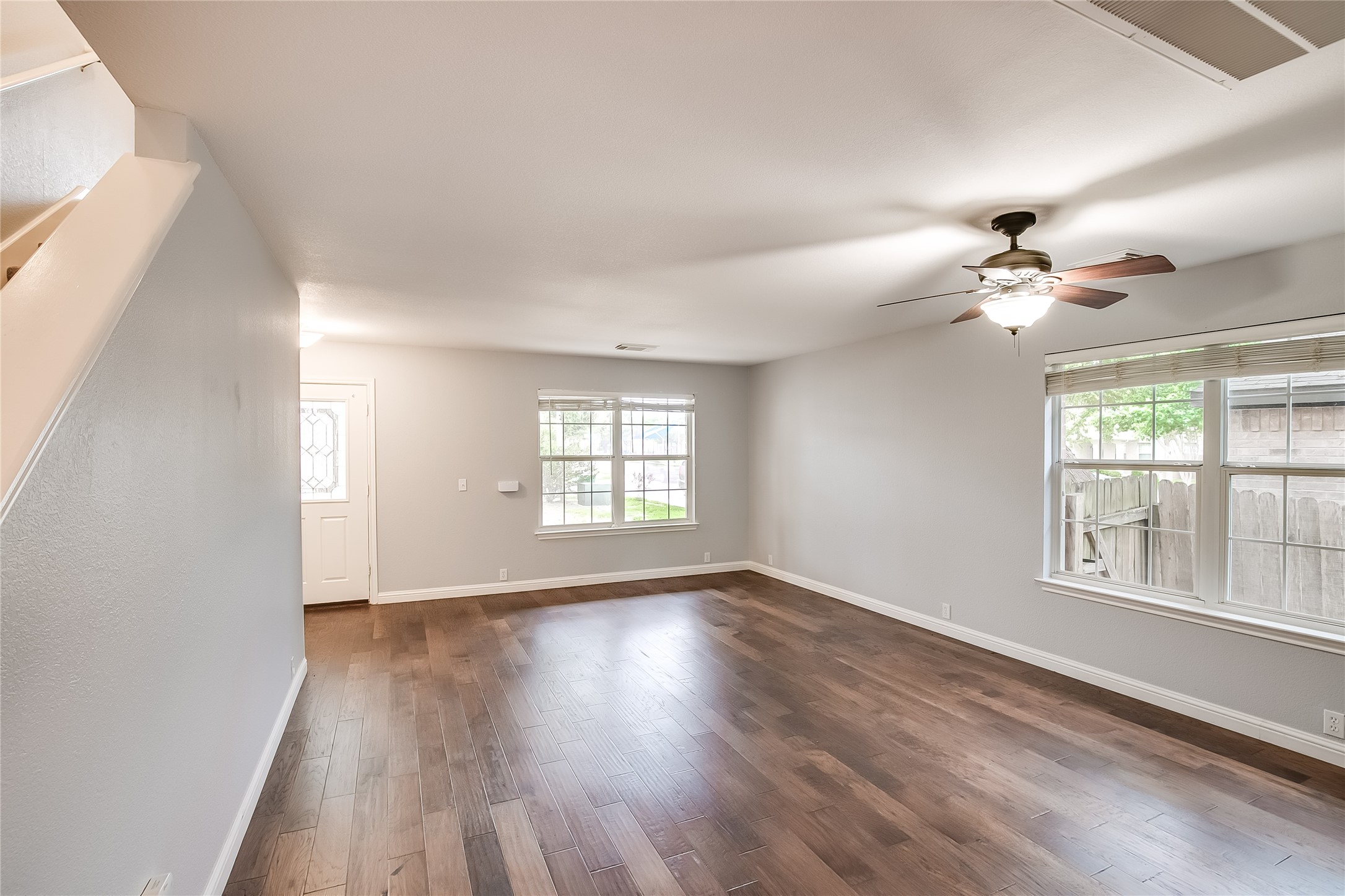 1204 Mathias Street Cedar Park, TX 78613 - Photo 6 of 32 a view of an empty room with a window and wooden floor