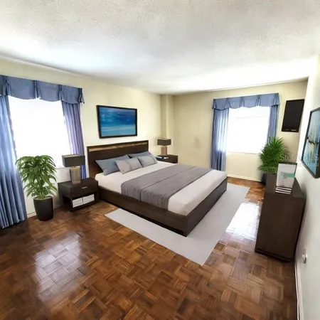 a bedroom with a bed potted plant with the outer view