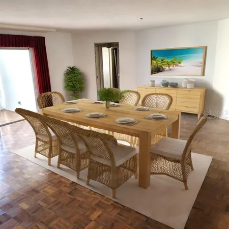 a view of a dining room with furniture