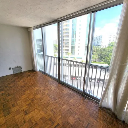 a view of an empty room and a window