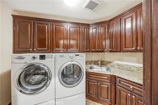 a view of a kitchen with washer and dryer