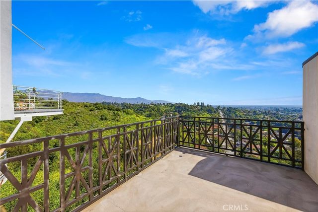 a view of a balcony with an ocean view