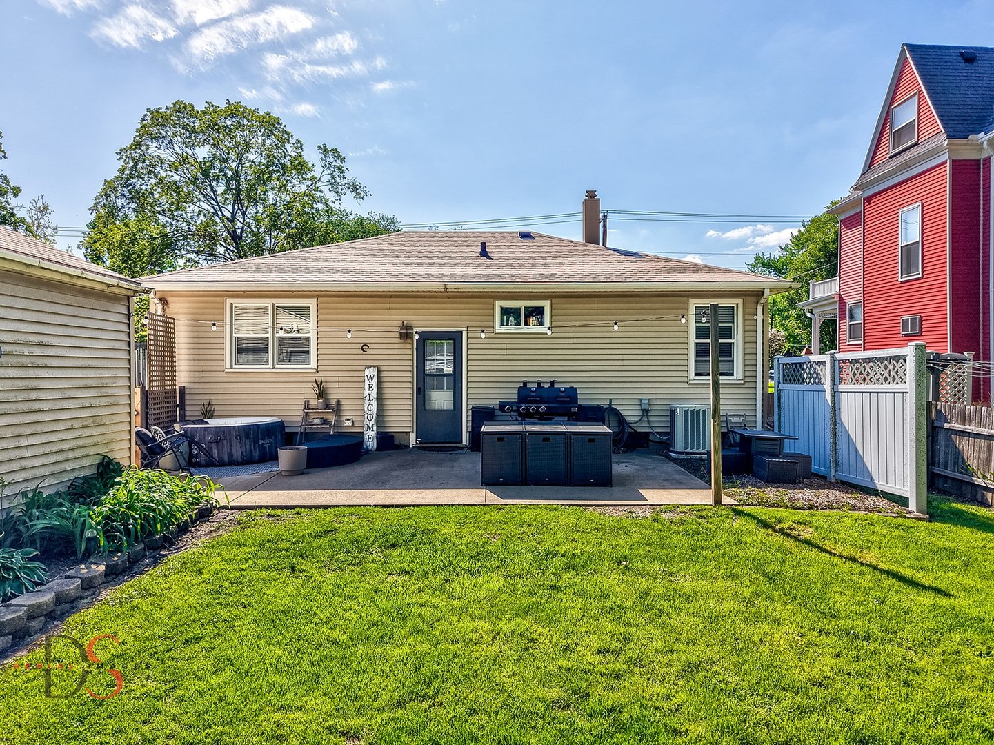 620 York Street Ottawa, IL 61350 - Photo 12 of 17 a view of a house with a patio and a yard