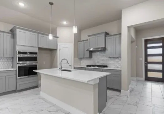 a bedroom with a large bed and a couch