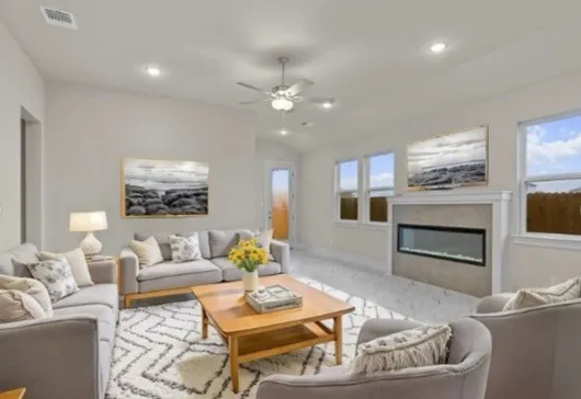 a kitchen with a stove a sink a refrigerator and cabinets