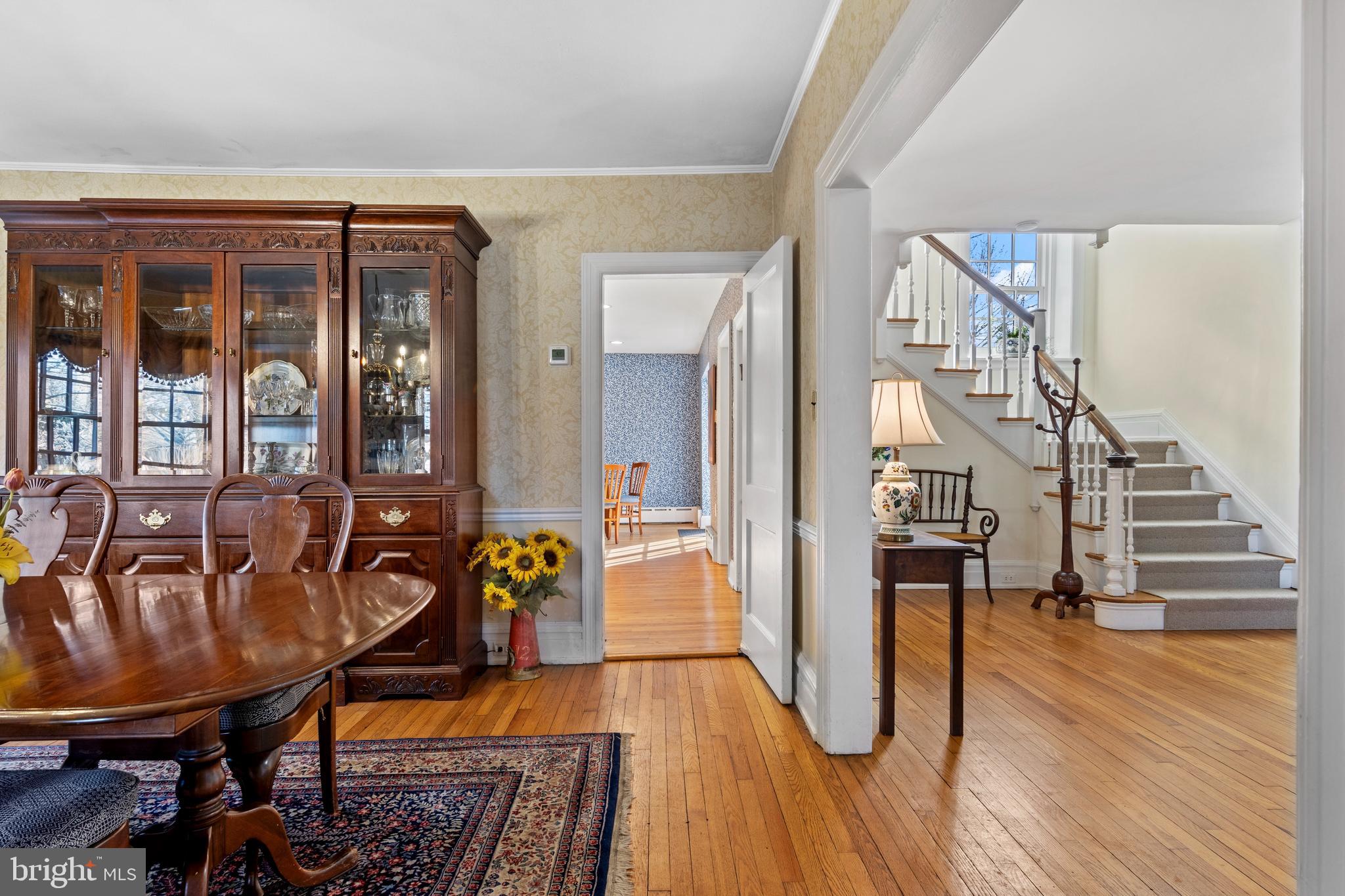 345 Llandrillo Road Bala Cynwyd, PA 19004 - Photo 15 of 54 a living room with furniture a wooden floor and floor to ceiling window