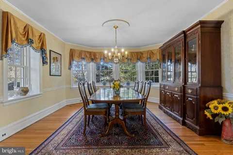 a view of entryway livingroom and hall with wooden floor