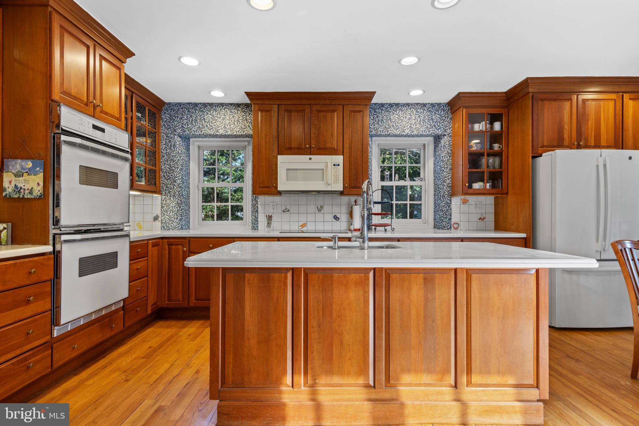 345 Llandrillo Road Bala Cynwyd, PA 19004 - Photo 22 of 54 a kitchen with stainless steel appliances granite countertop a sink and wooden cabinets