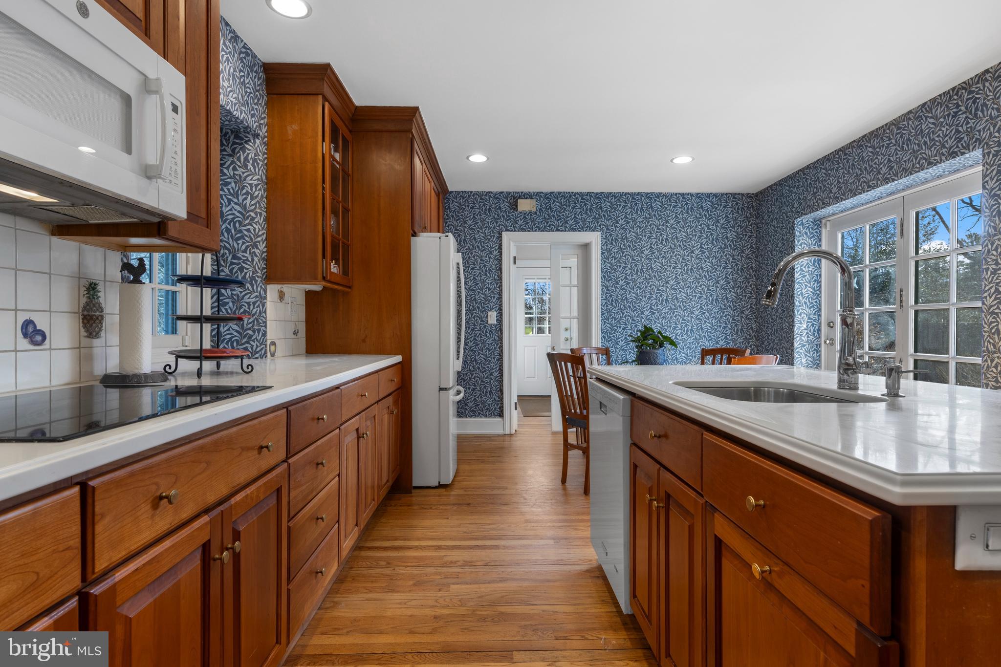 345 Llandrillo Road Bala Cynwyd, PA 19004 - Photo 23 of 54 a kitchen with stainless steel appliances granite countertop sink stove top oven and cabinets