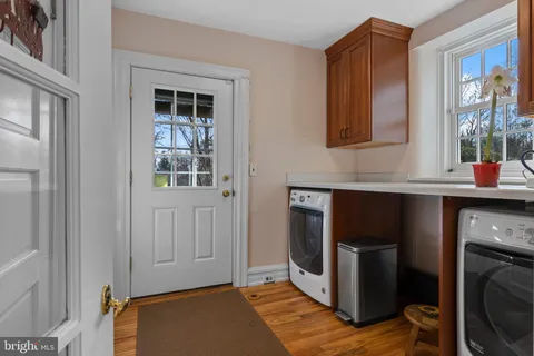 a spacious bedroom with a bed and a fireplace