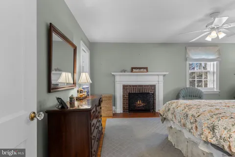 a bedroom with a bed and a lamp