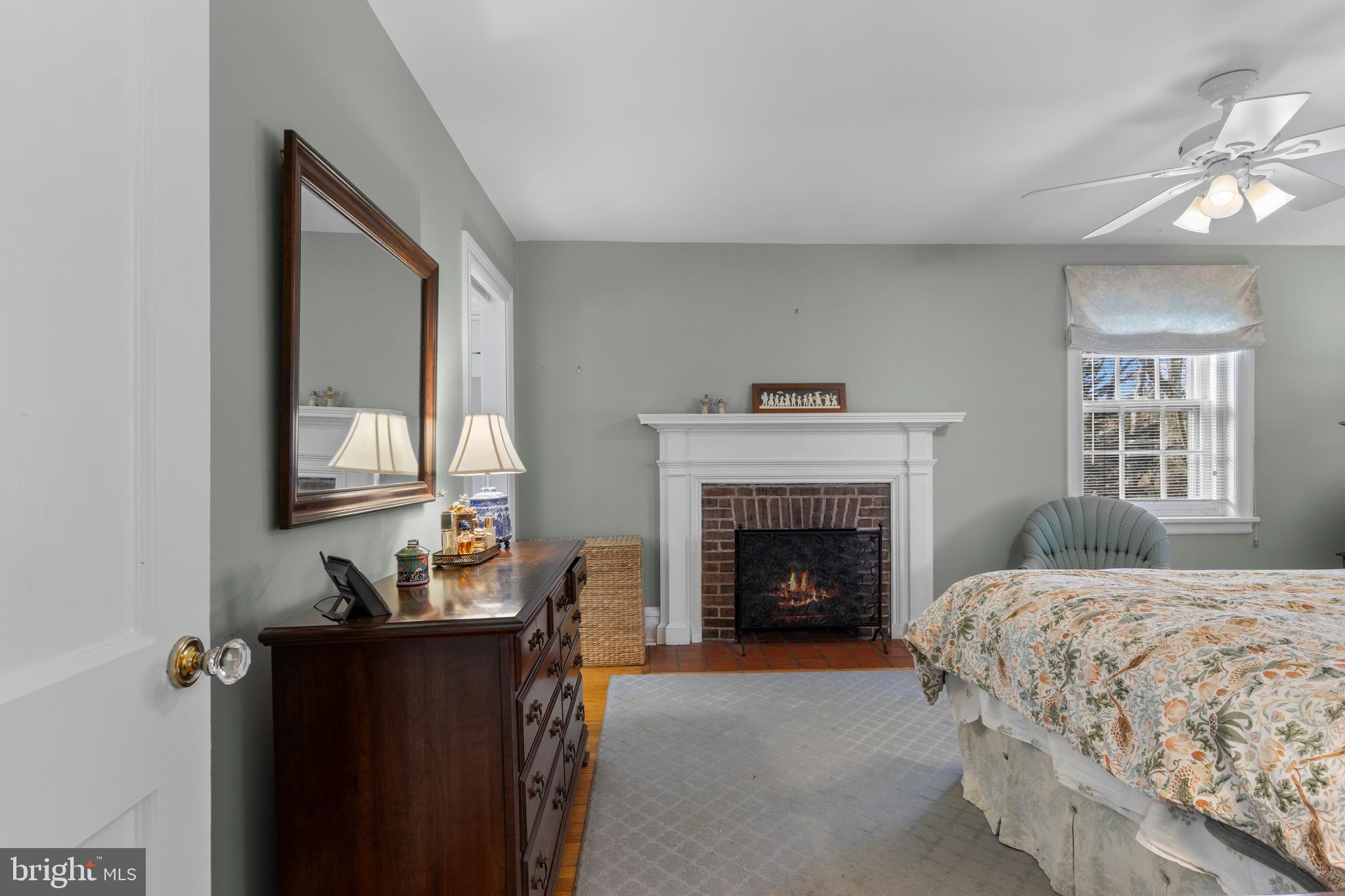 345 Llandrillo Road Bala Cynwyd, PA 19004 - Photo 31 of 54 a bedroom with a bed and a fireplace