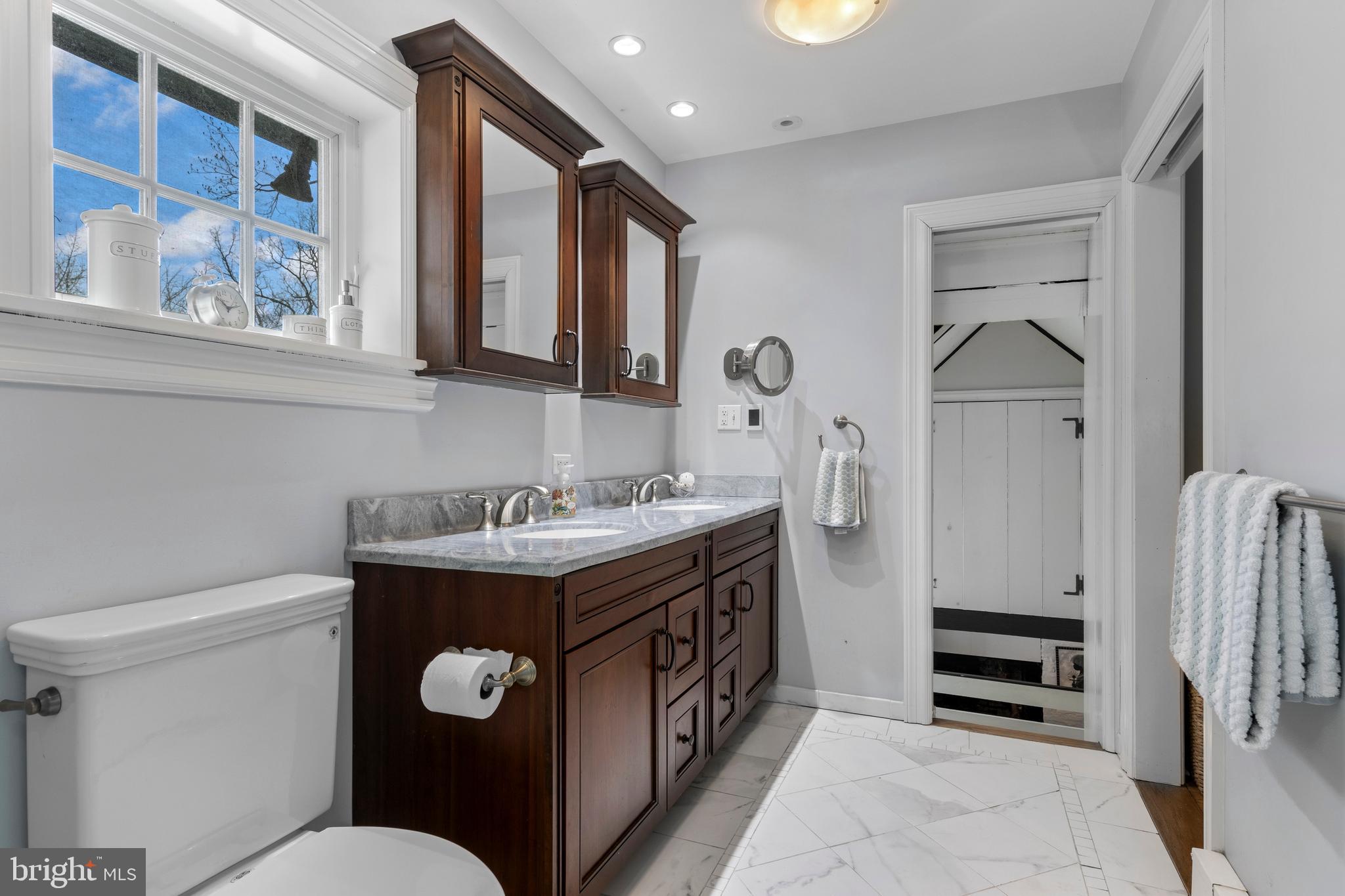 345 Llandrillo Road Bala Cynwyd, PA 19004 - Photo 34 of 54 a bathroom with a sink a toilet and a mirror