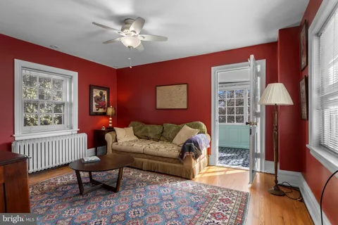 a bedroom with furniture and a window