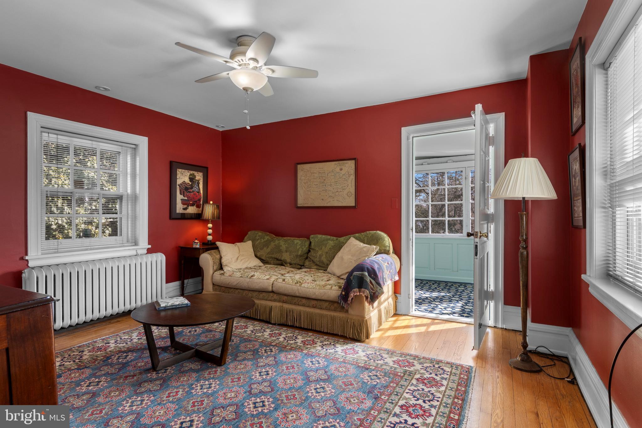 345 Llandrillo Road Bala Cynwyd, PA 19004 - Photo 40 of 54 a living room with furniture two windows and a chandelier