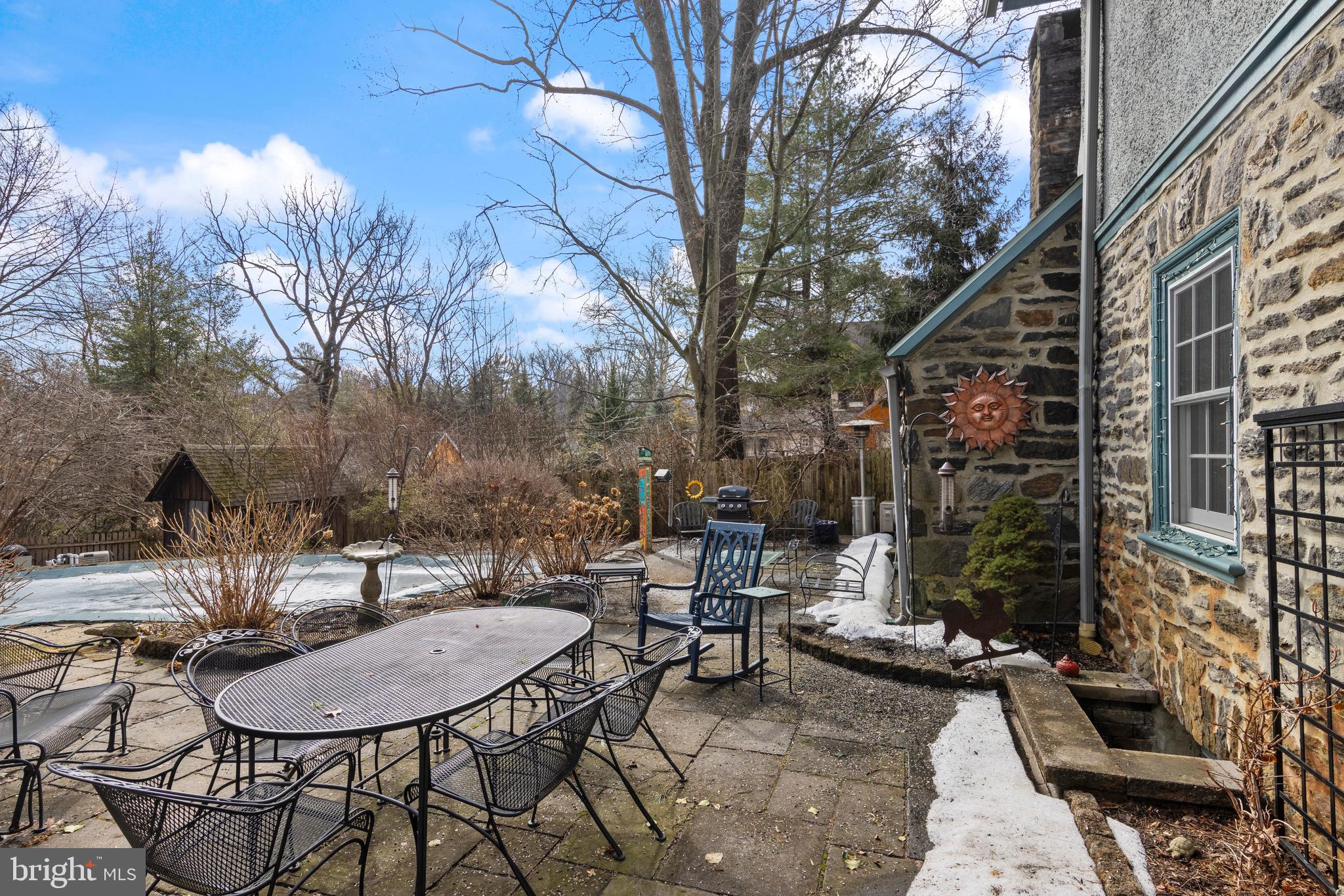 345 Llandrillo Road Bala Cynwyd, PA 19004 - Photo 51 of 54 a backyard of a house with table and chairs