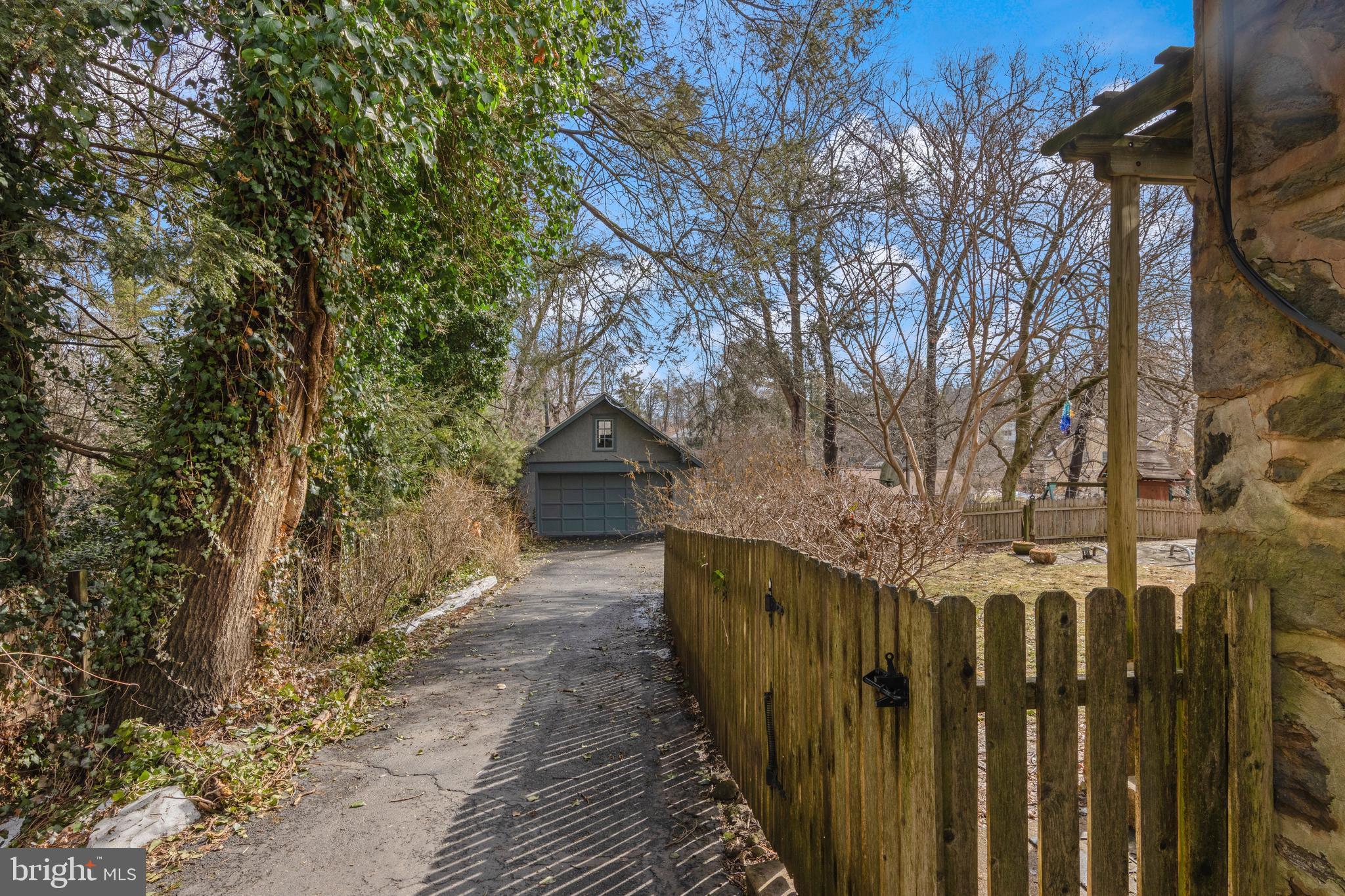 345 Llandrillo Road Bala Cynwyd, PA 19004 - Photo 53 of 54 a view of a wooden fence under a large tree